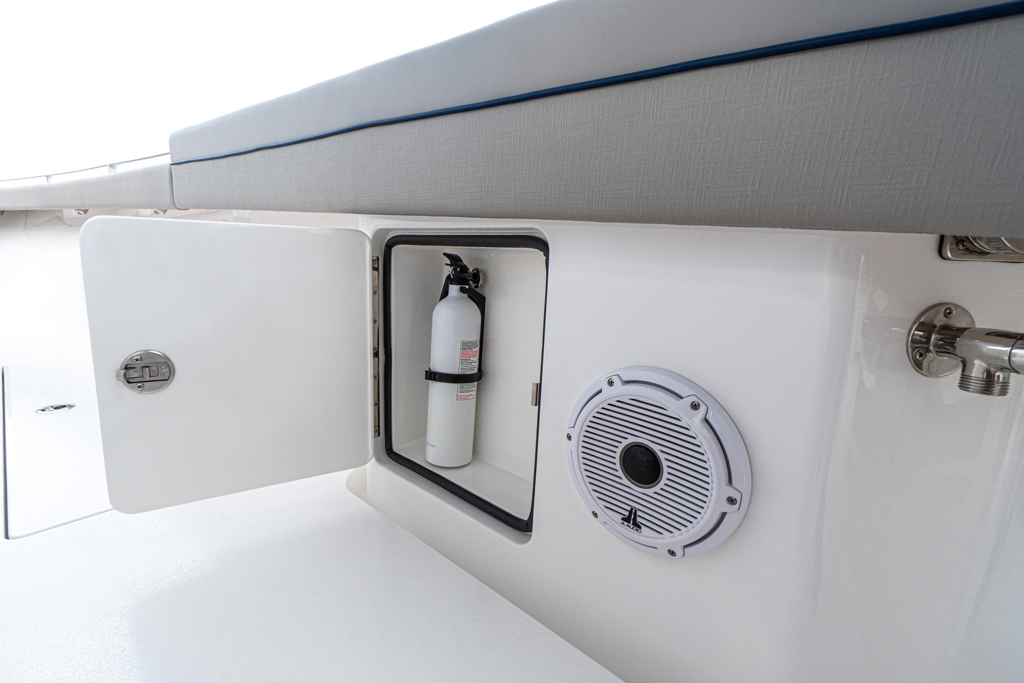 Dedicated locker for fire extinguisher, optional JL Audio speaker, seawater washdown.