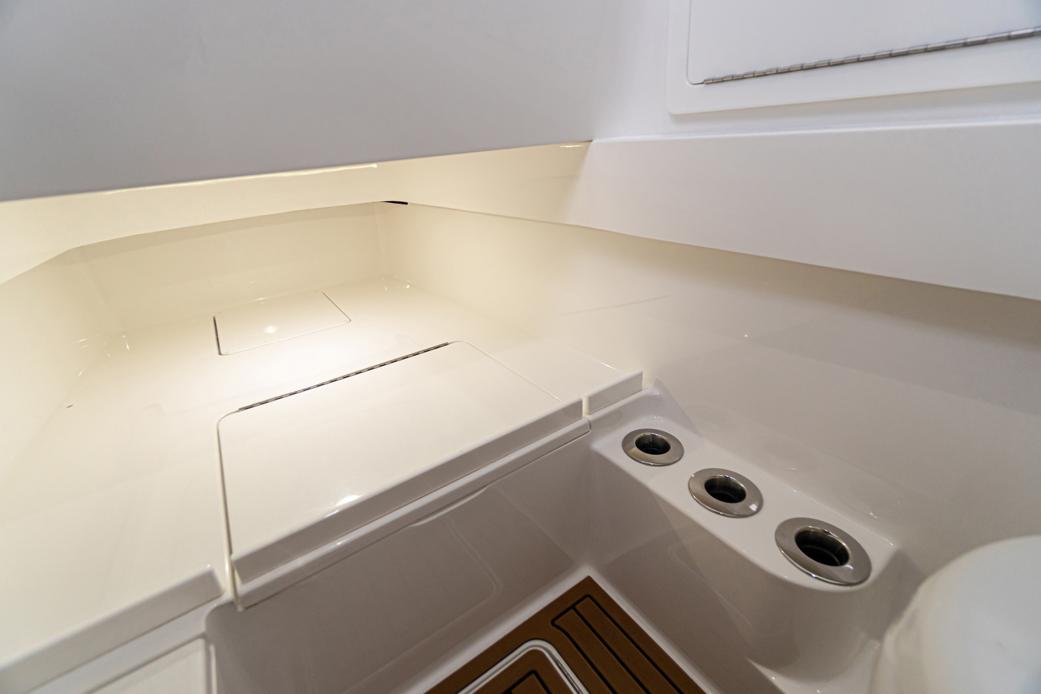 Versatile storage area under lounge seating for rods, gear, supplies.