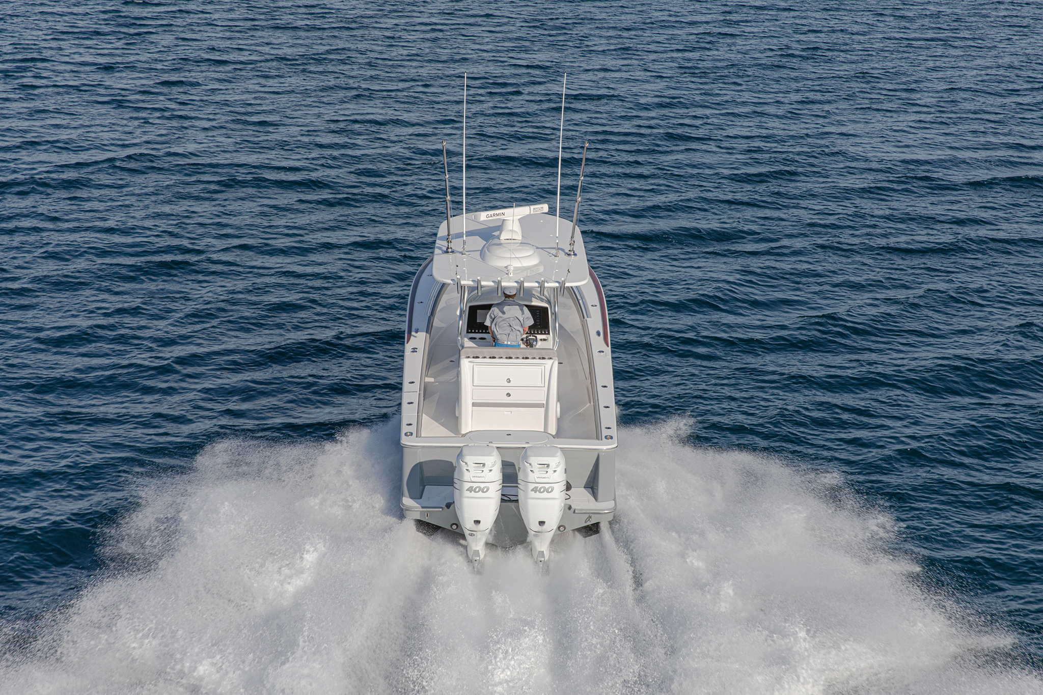 Range exceeds 460 miles at 45 mph with twin Mercury 400s.