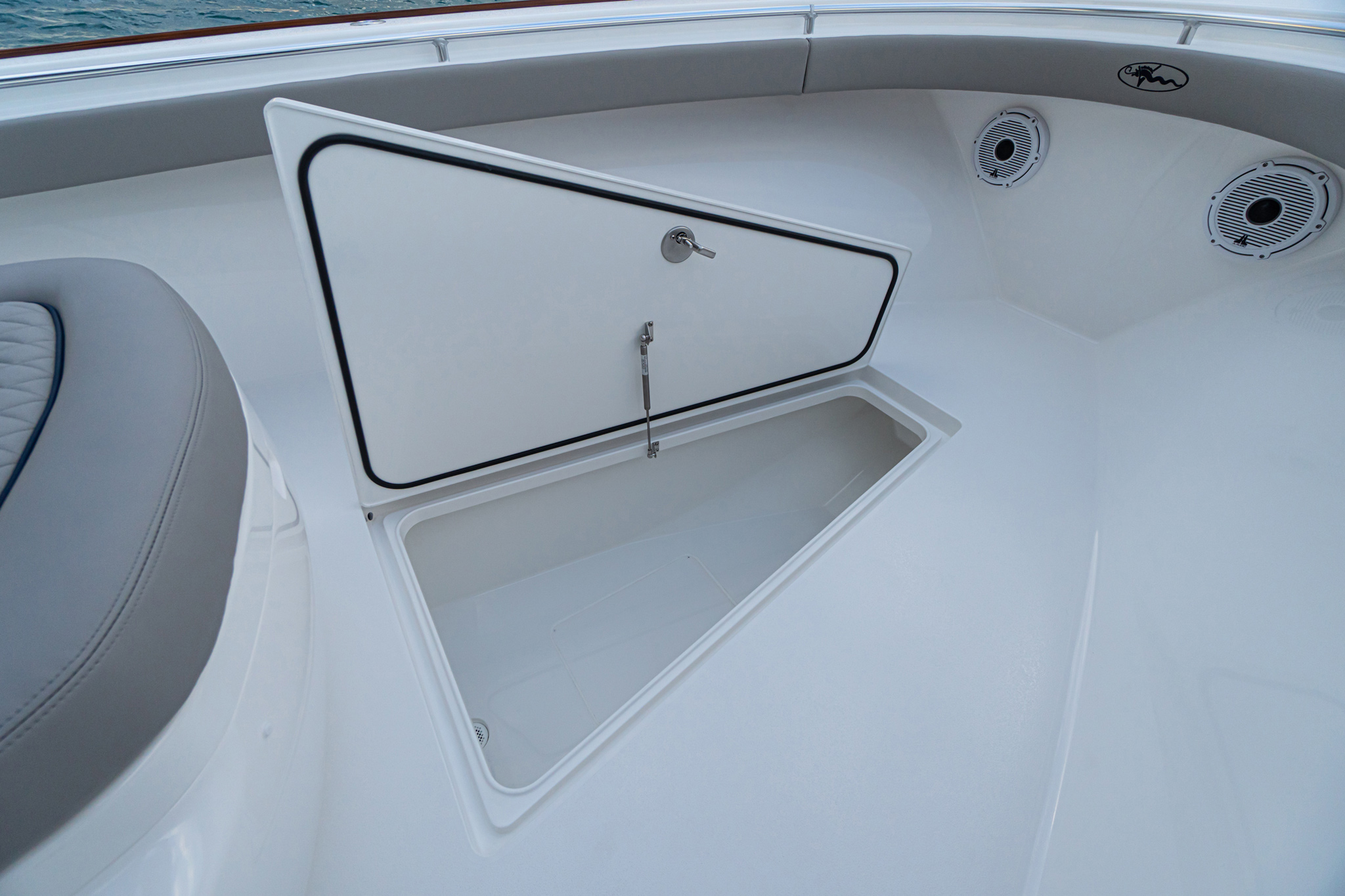 Insulated forward in-deck fish box drains overboard; access to available bow thruster.