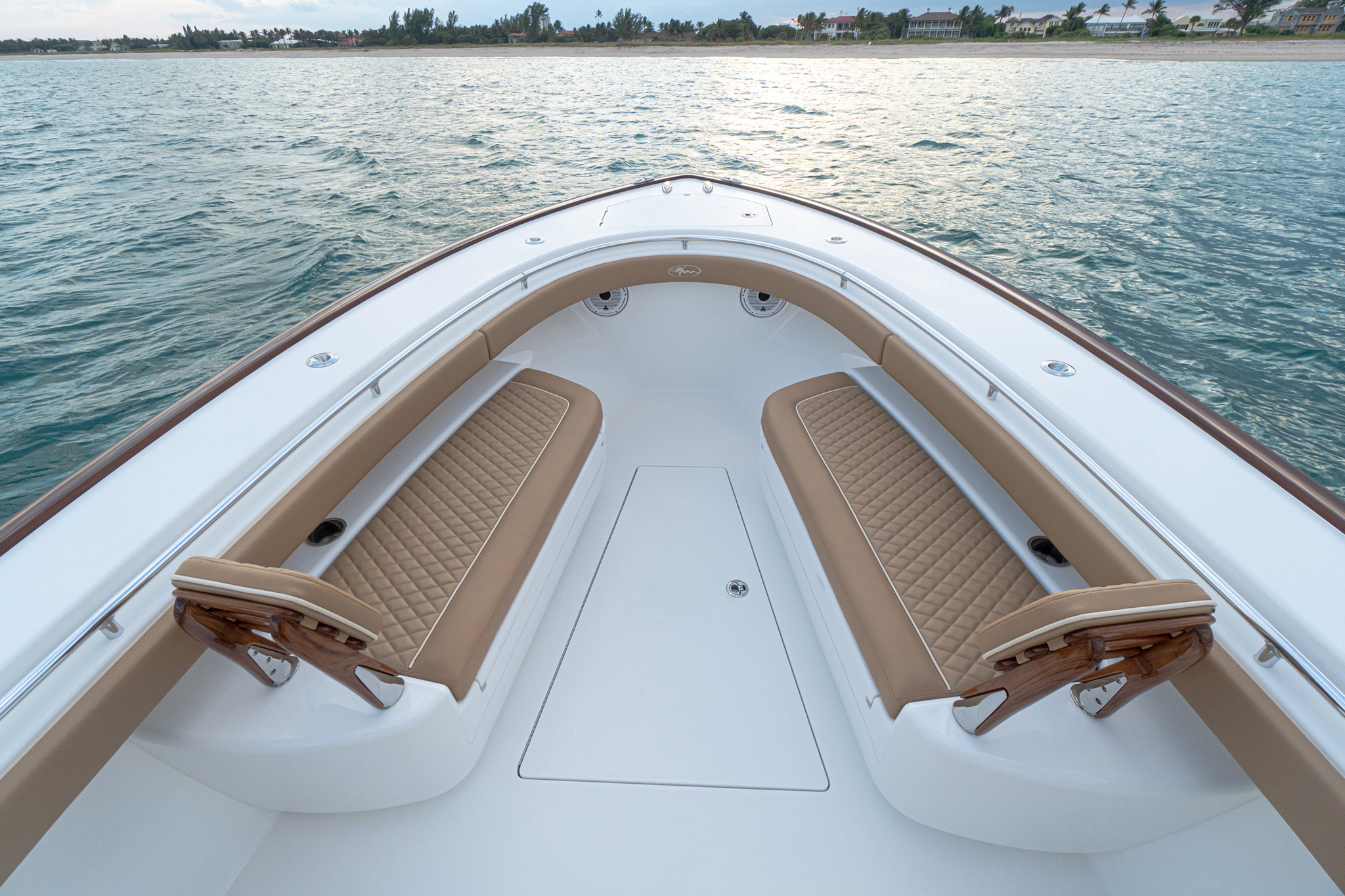 Available forward seating with Release Marine teak backrests; full forward bow access.