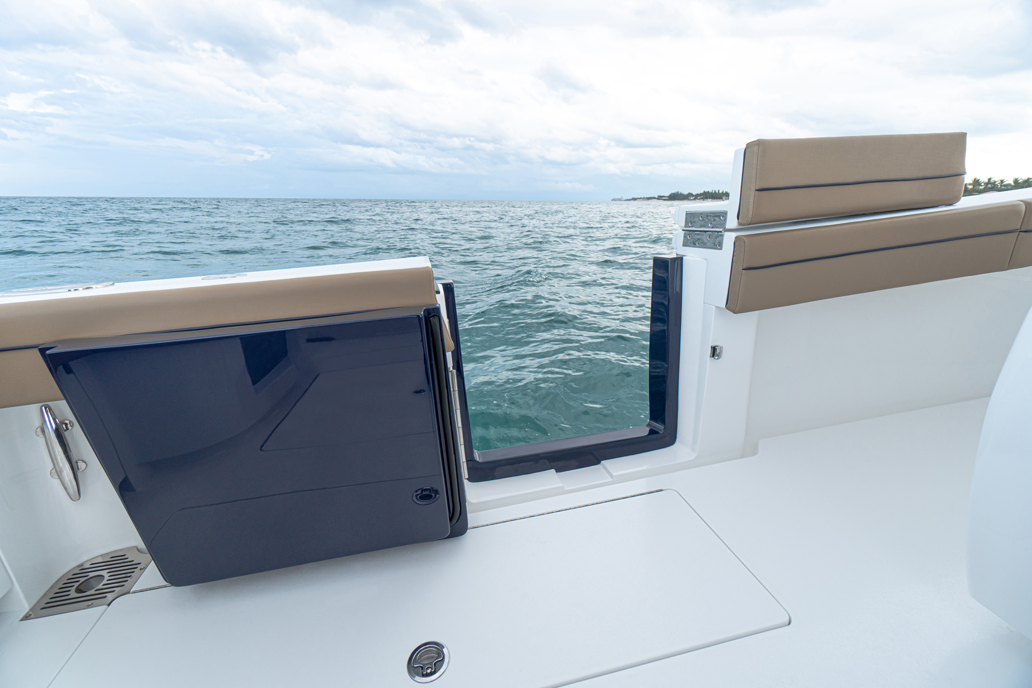 Standard port-side dive door swings inboard 180 degrees for safety and convenience.