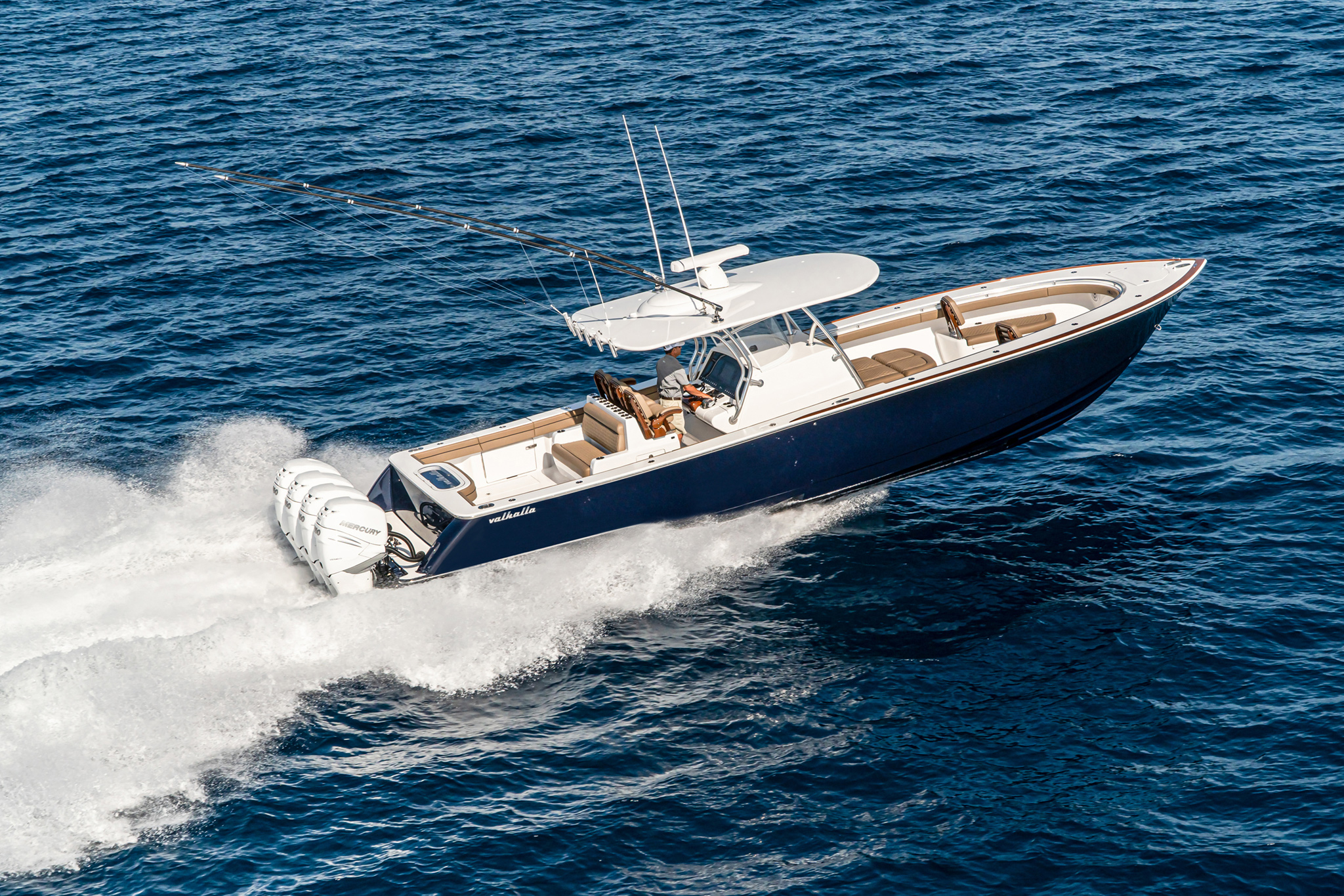 The flagship hits 74 mph with quad Mercury 400s.