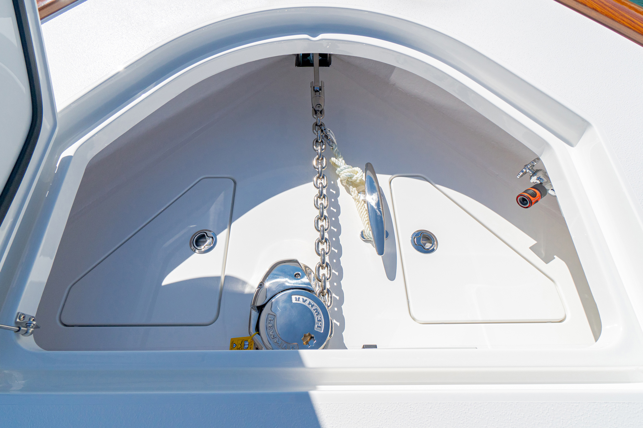 Large anchor locker with electric windlass, anchor chute, access panels and freshwater wash down.